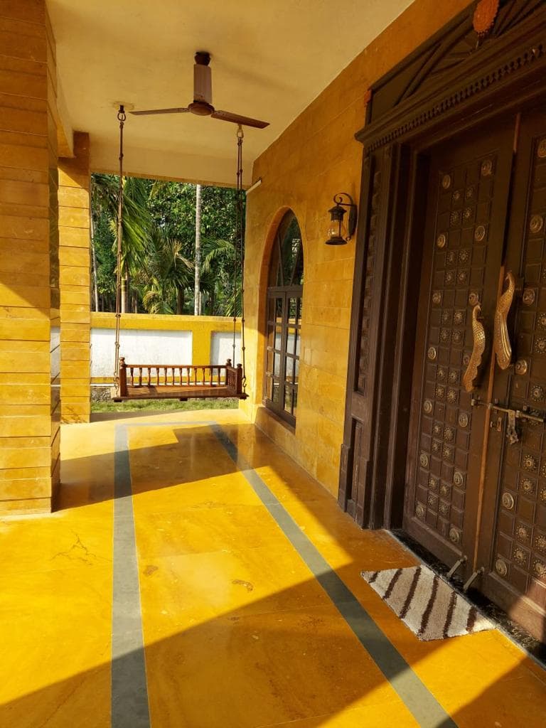 The front porch, with its swing and carved door