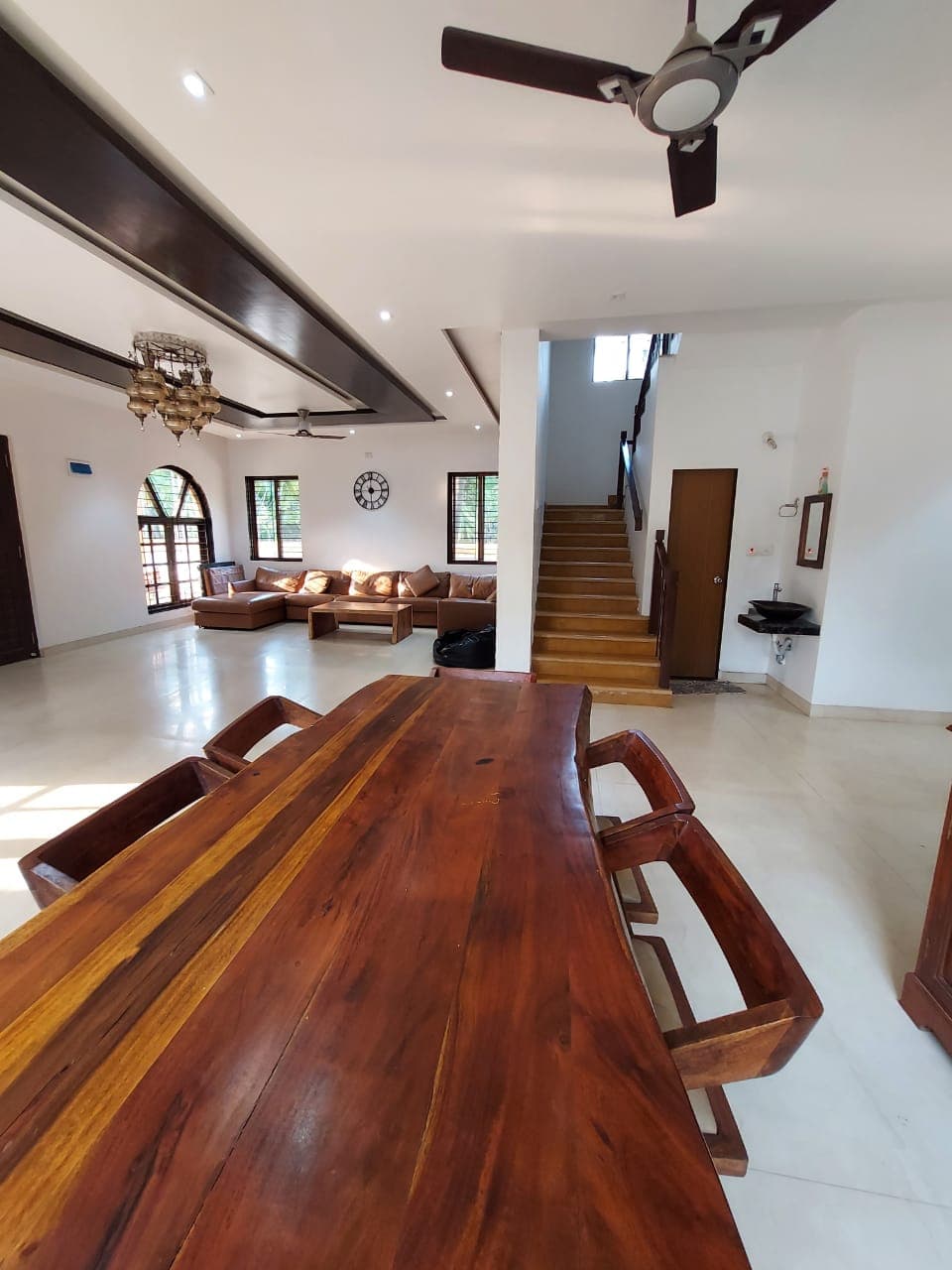 Dining table with the staircase behind