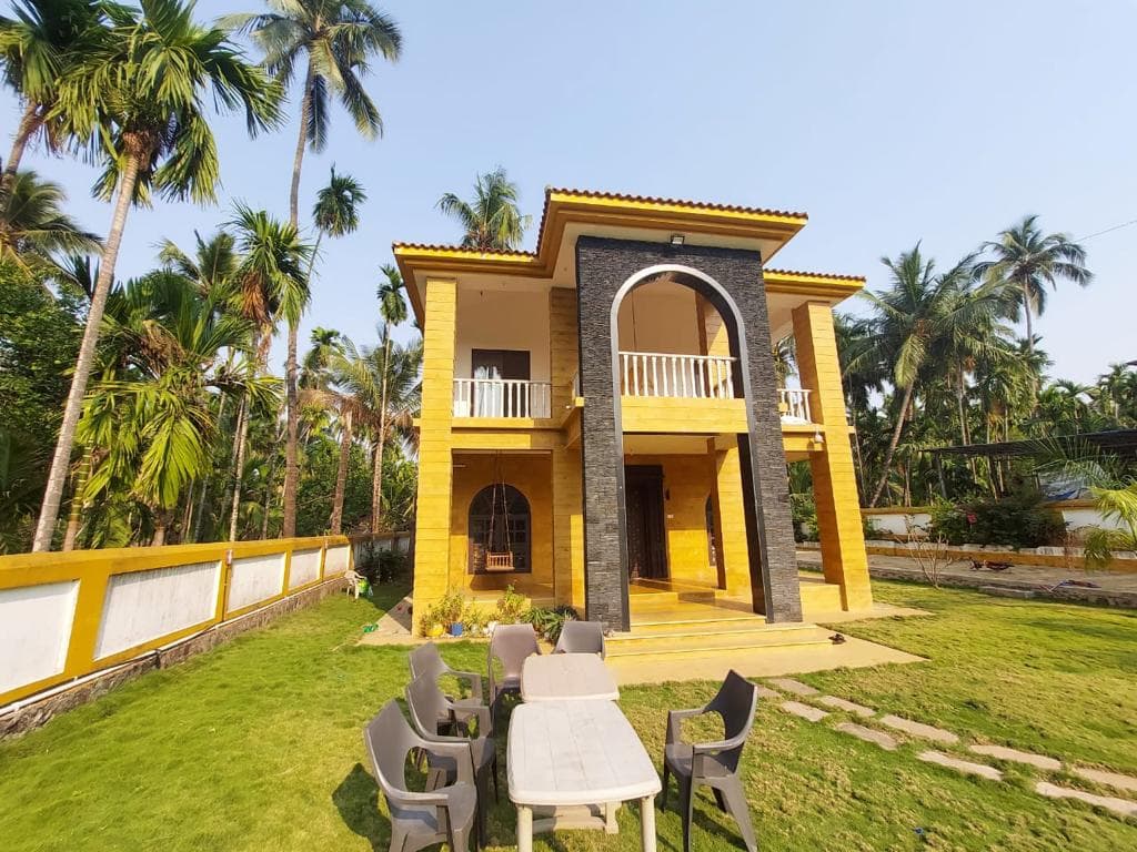 The front of the bungalow among the palms